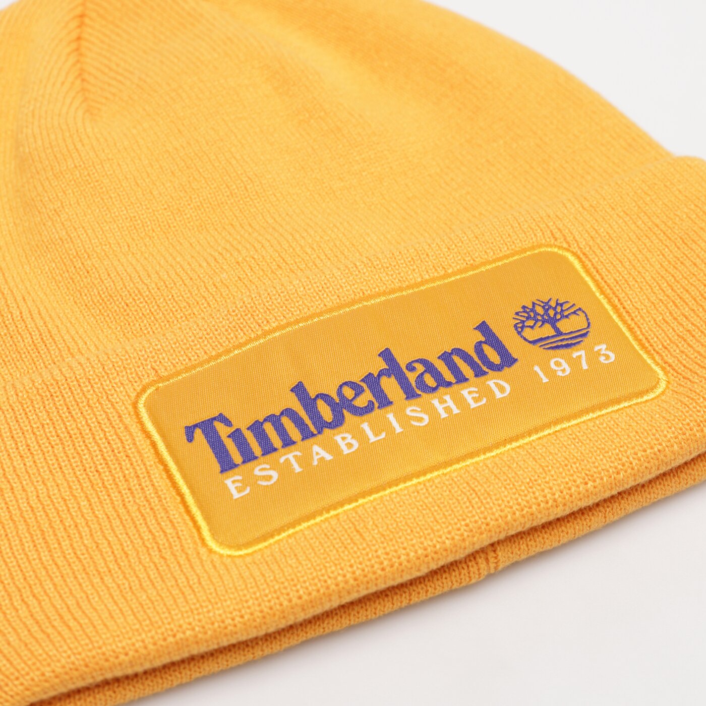 Дамска зимна шапка TIMBERLAND ШАПКА ESTABLISHED 1973 tb0a2ptd8041 цвят жълт