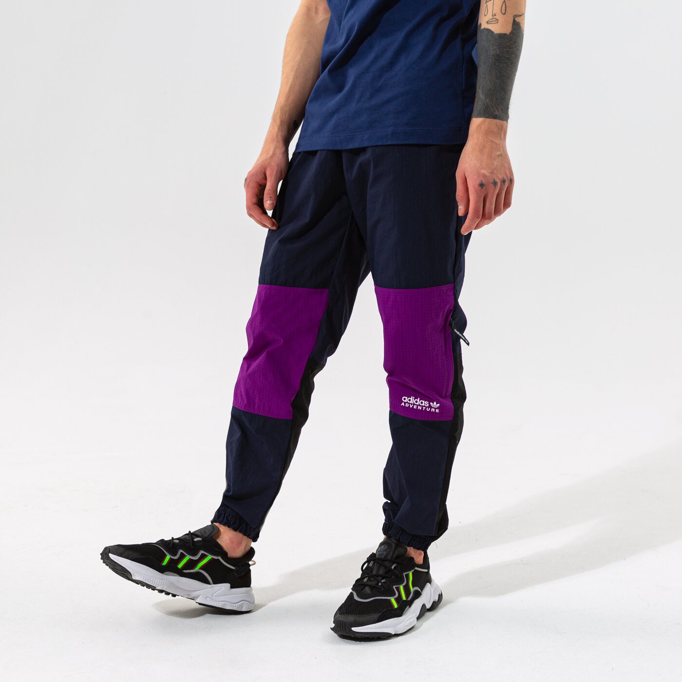 Мъжки панталони ADIDAS ПАНТАЛОНИ WOVEN PANTS h09051 цвят виолетов